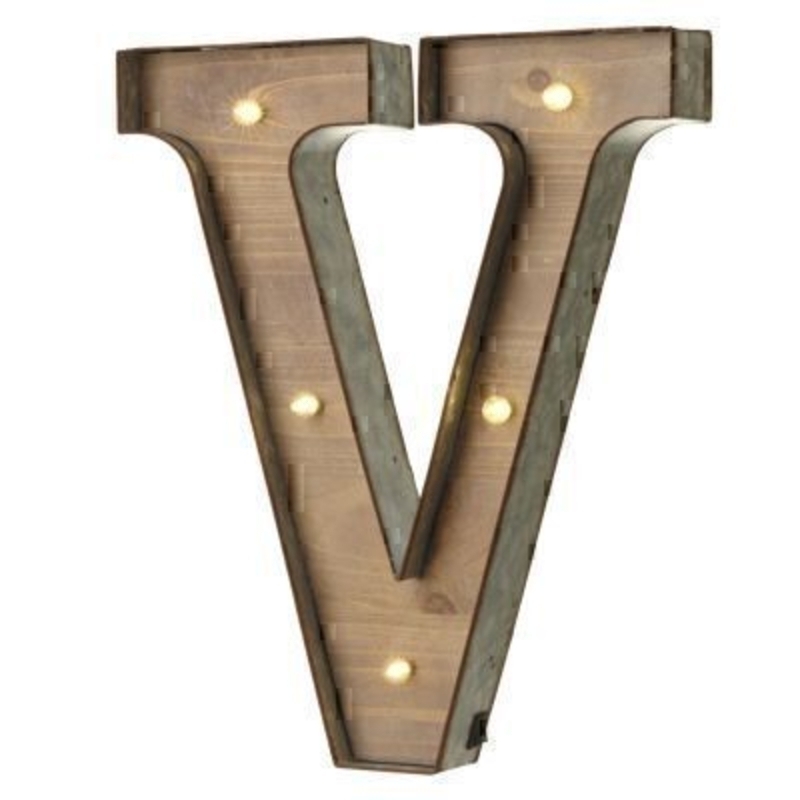 V Sign With LED Lights by Heaven Sends This V Sign With LED Lights by Heaven Sends could be paired with other letters to create a bespoke initial sign for a couple or to be displayed on its own. Large in size this R sign has got LED lights and a switch on the side to turn it on. Made from wood and metal. Size: 35x5x41cm
